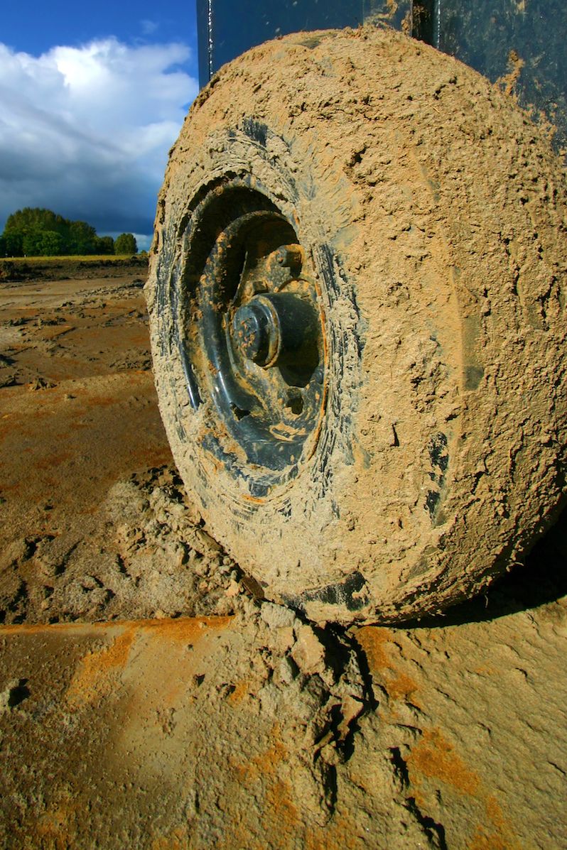 truck tire caked with mud